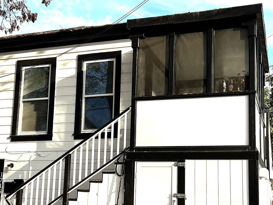 Exterior pictured showing upper available unit and porch