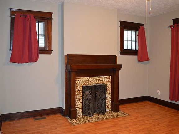 Beautiful Fireplace in Living Room.  Original Woodwork.