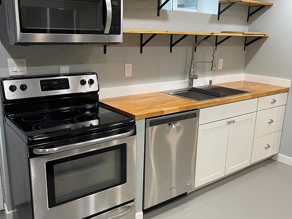 Brand new appliances including a dishwasher in the kitchen.