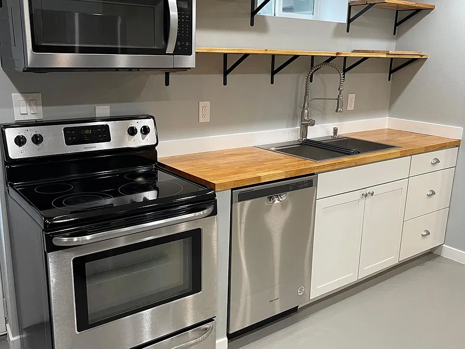 Brand new appliances including a dishwasher in the kitchen.