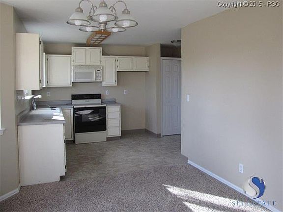 The cute country kitchen is waiting for your personal touches! Fresh paint, new flooring, and new lighting for the dining area.