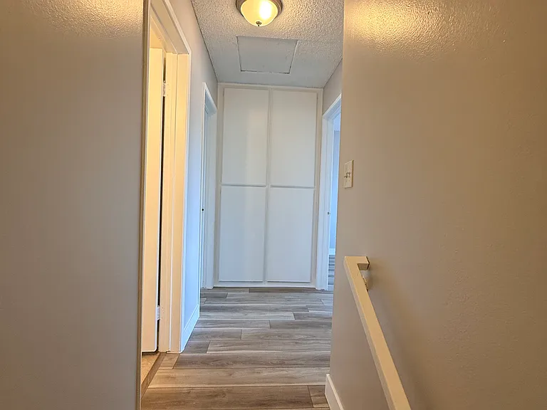 Upstairs hallway with additional storage