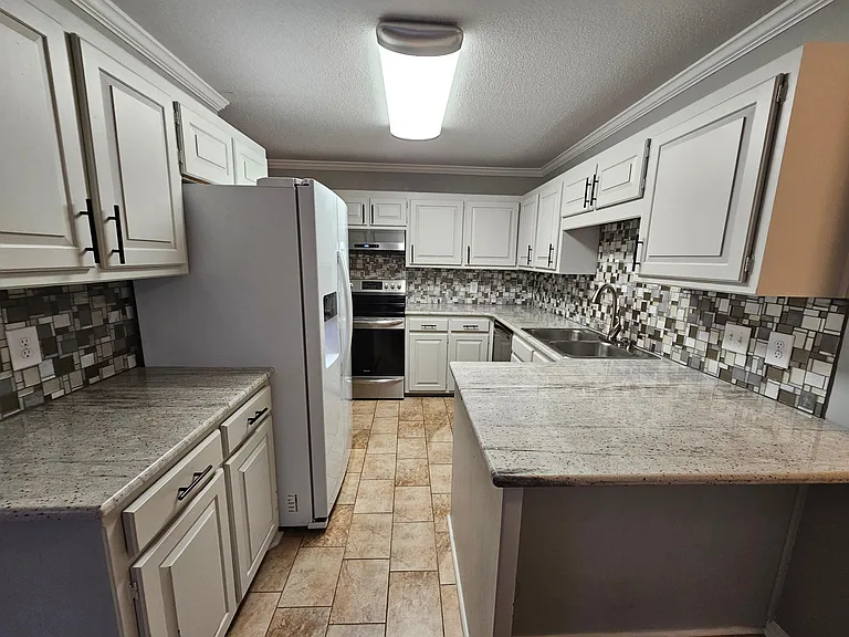 Large kitchen with plenty of counter space.