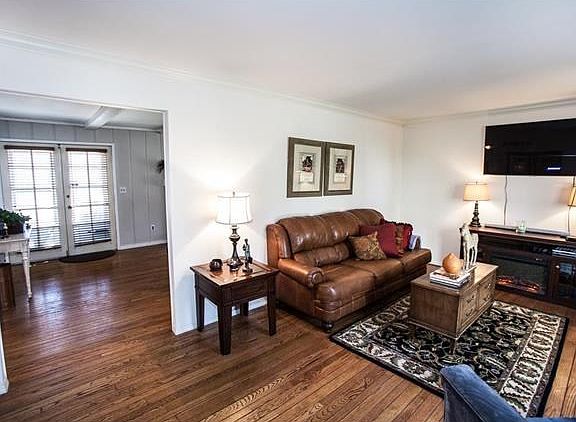 The view from the foyer into the living room and family room.