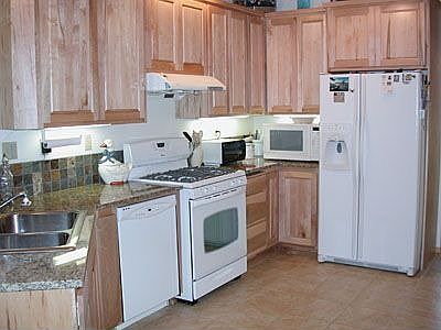 Kitchen with tile floors and granite counters