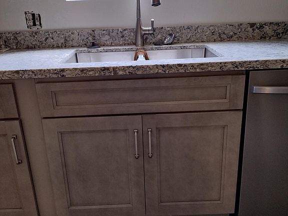 brand new kitchen appliances, including trash can for regular trash and recycle