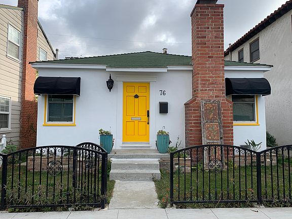 Front view of house. Owner lives here and rental unit is behind, above the 2-car garage.