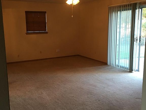 Living room showing patio door. Dining is located to the left. Din