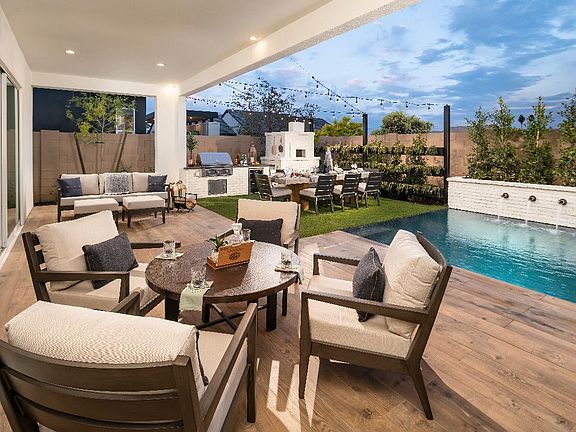 Covered patio with pool and pizza oven