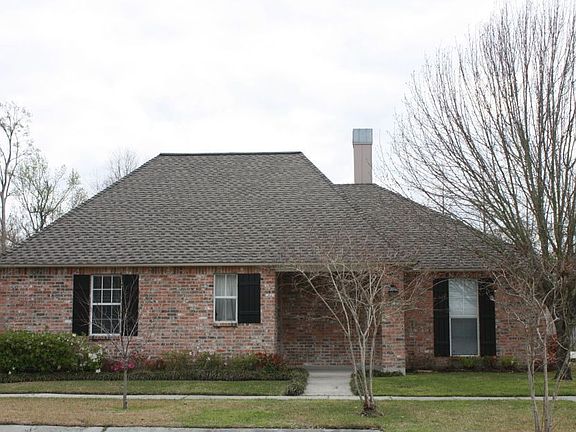 brick and asphalt shingles