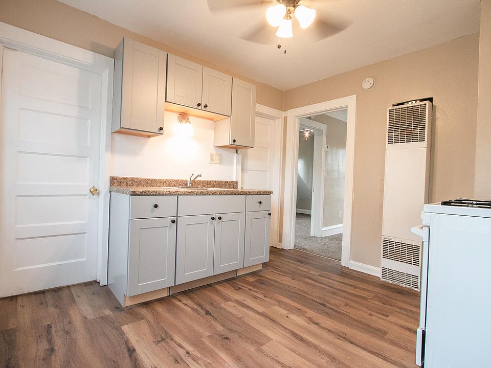 Fully renovated kitchen with brand new appliances, cabinets, and flooring.