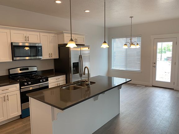 Open concept to dining area and living room and patio.