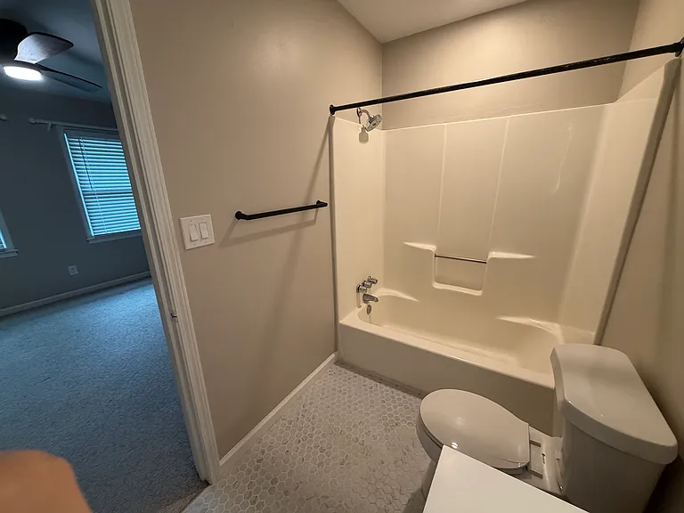 The front bedroom's Bathroom with a tub