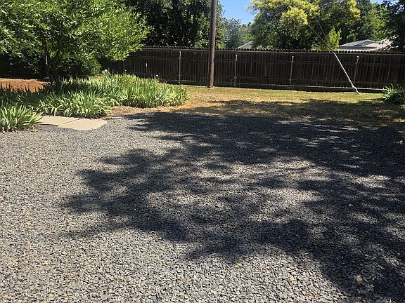 Parking area off driveway and front entrance