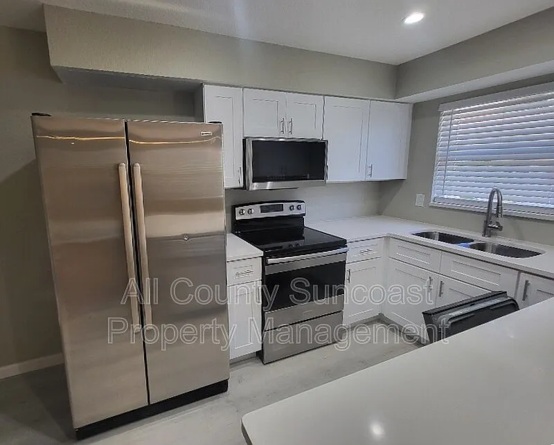 Building Photo - 9030 Blind Pass Rd #C9