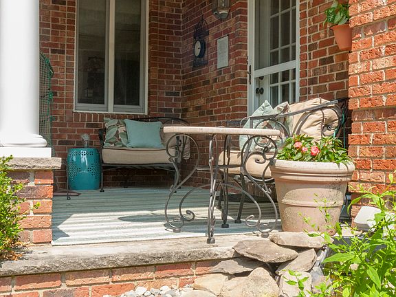 Relax on front porch by pond