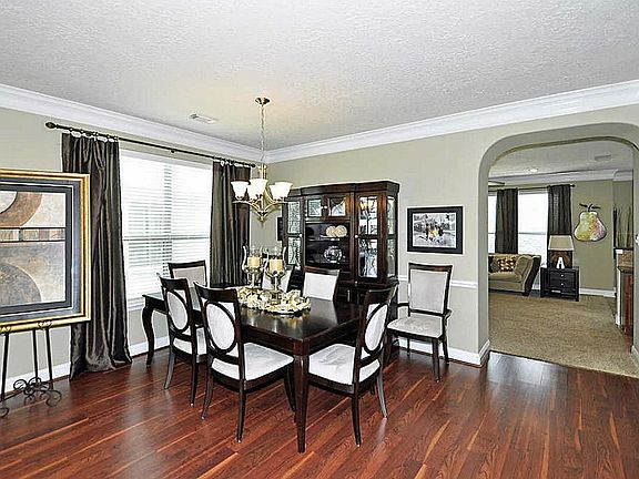 Dining close to kitchen & has chair rail & upgraded chandelier.