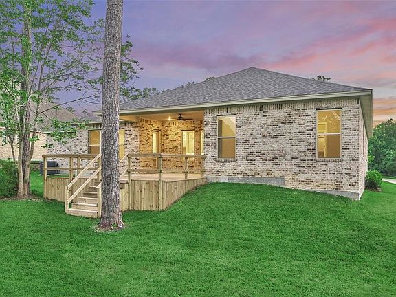 Check out your new backyard with a custom deck, which is the perfect spot to relax in the sun.
