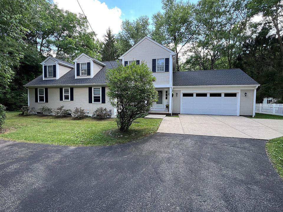 Front of home sits far from the road.