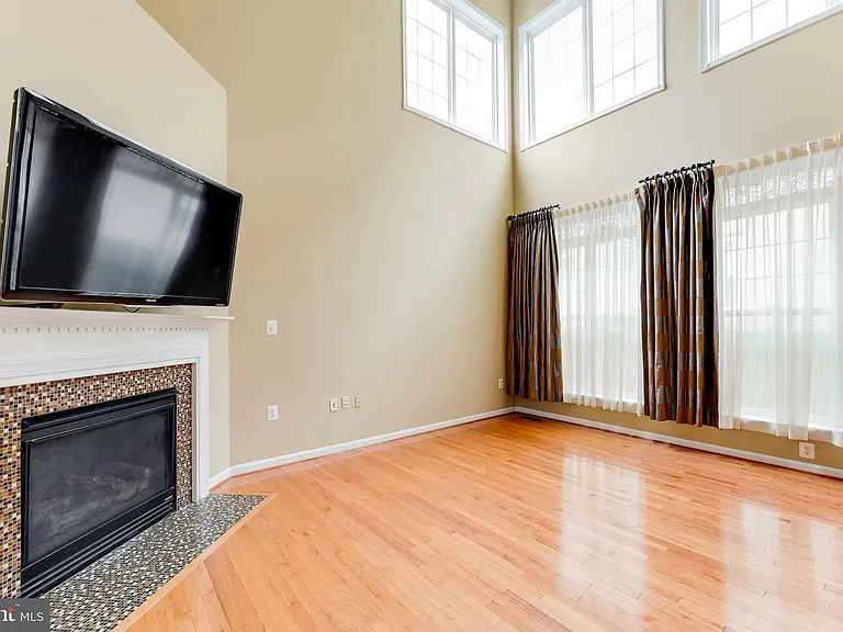 Great Room/ Family Room with 19' cathdral ceiling, lots of windows to let in natural light