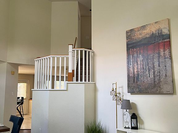 Dining room to stairs and family room from front.