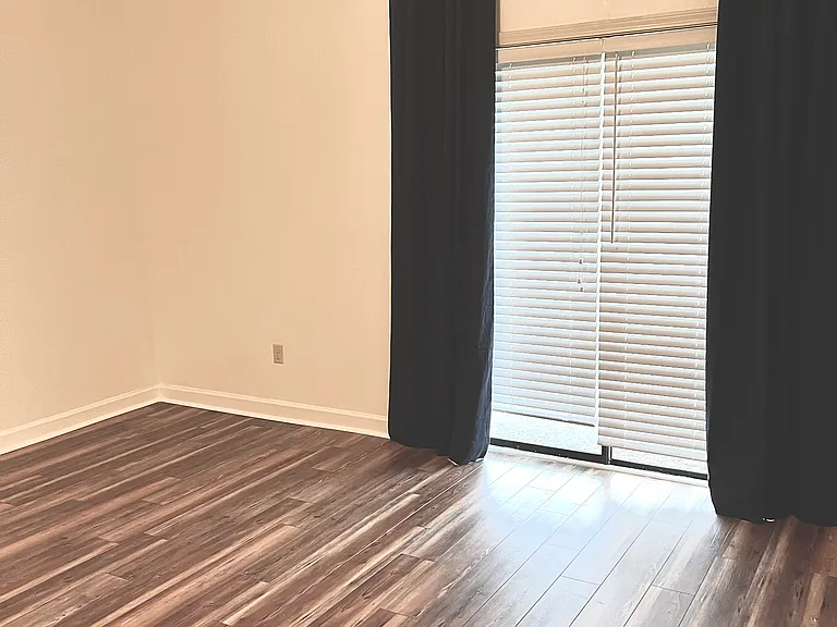 Master bedroom with luxury vinyl floors added 2 years ago.