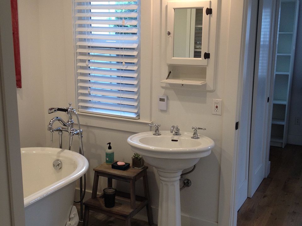 Kohler appointed bathroom with claw foot tub