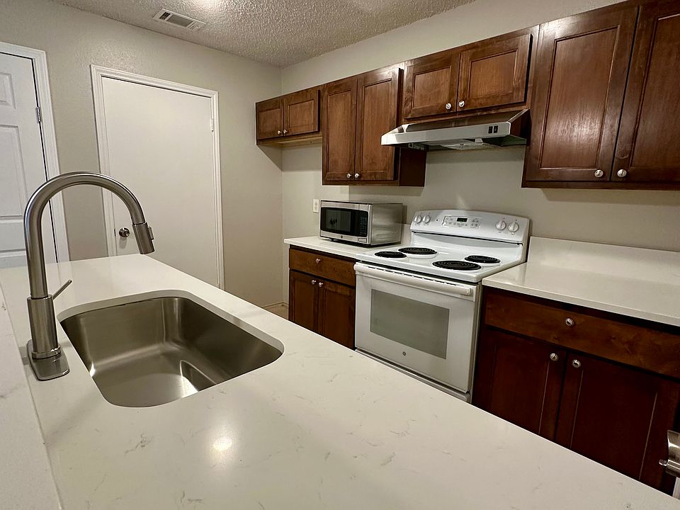 Kitchen with beautiful quartz countertops and stainless steel hardware