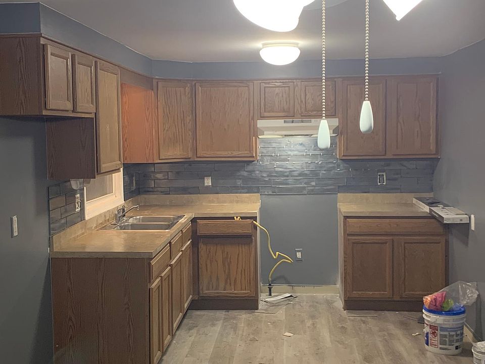 Large dine in kitchen. New paint, flooring and backsplash. New stainless steel range hood installed soon. still being updated