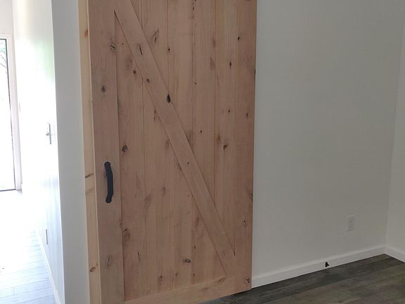 Sliding door separates bedroom and living room.