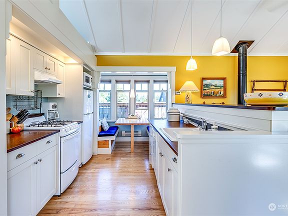 This is the view as you enter the home. Love the lighting about the range area.>