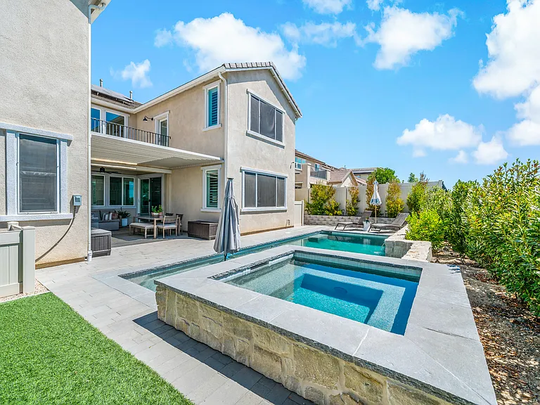 Elevated spa looks over the full yard & California Room