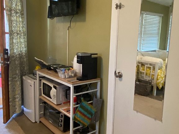 Kitchenette area. Taller fridge now in space.
