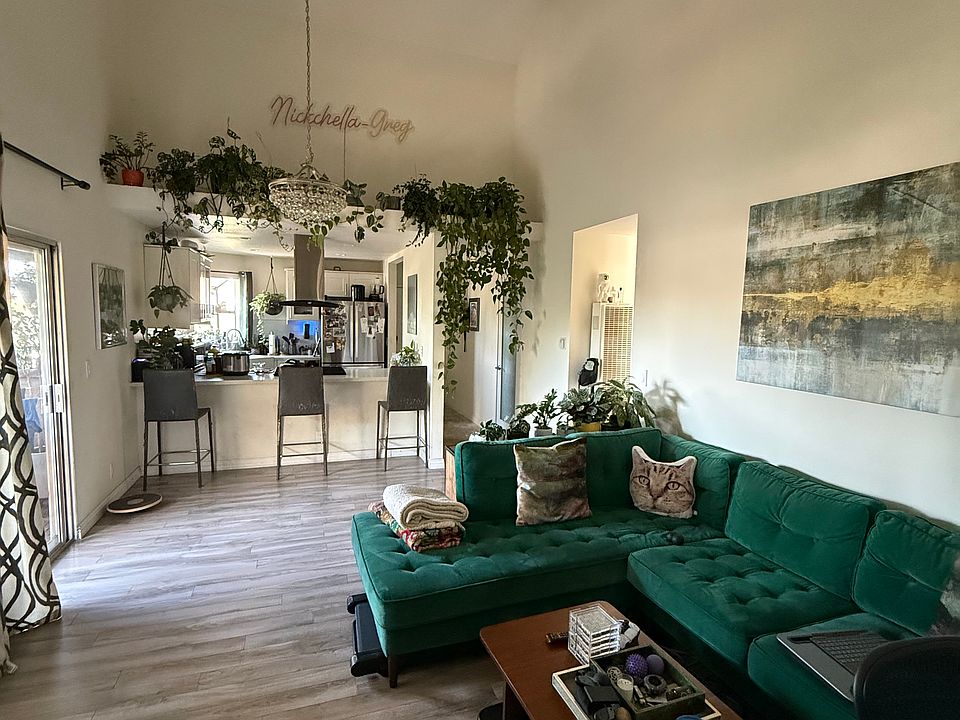 Open view from living room into kitchen. lots of natural lighting