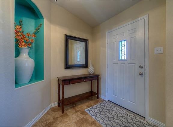The front door opens to an an inviting foyer entry.