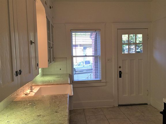 Side door from kitchen accesses the wrap around porch