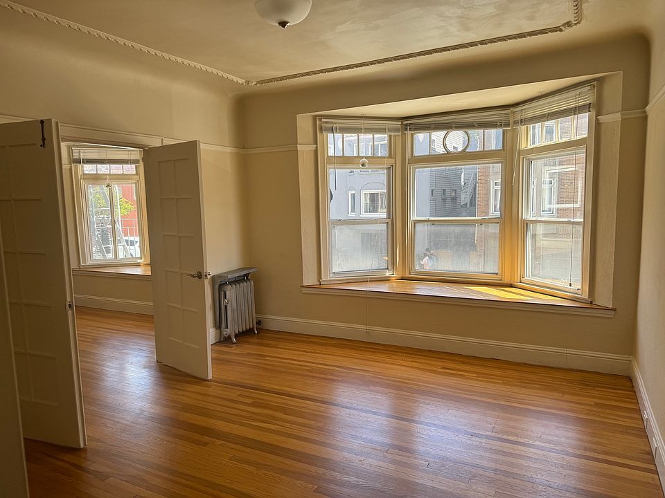 Bay windows and French doors separating main rooms