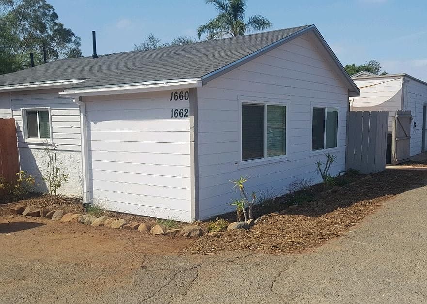 Front of house 1660 with parking to left