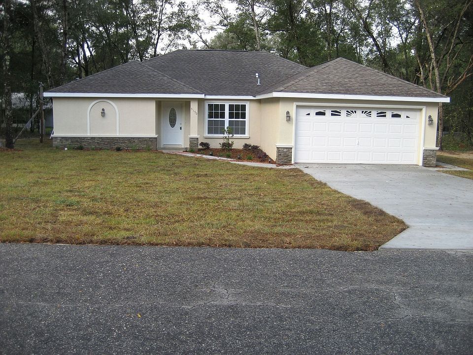 Newly built 3/2/2 with cultured stone and decorative banding for front of home