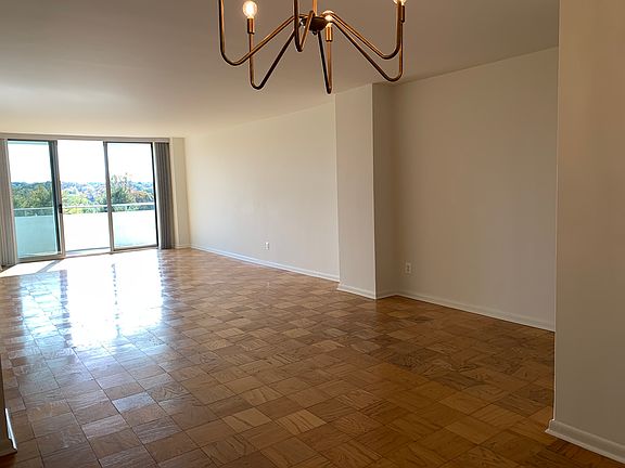Living Room with Attache balcony with view of DC and Virginia