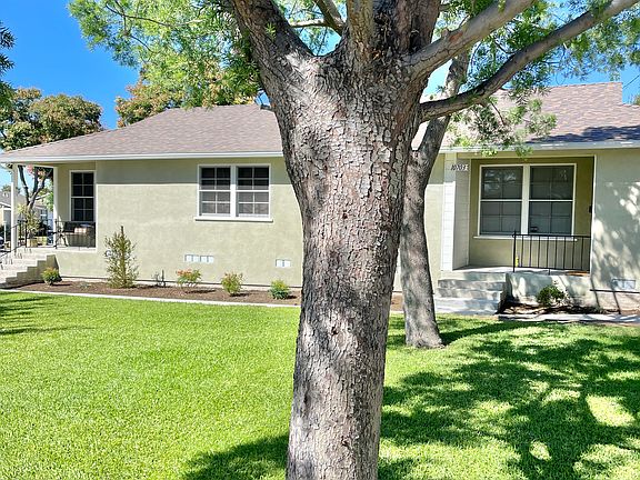 The apartment for rent is to the right of the trees. It has only one shared wall and that wall has been sound proofed for privacy