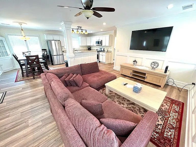 Spacious, open living area with sectional sofa and Smart TV