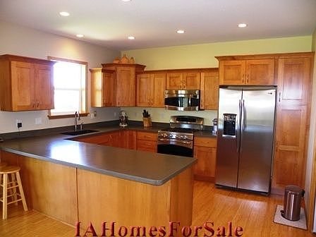 Kitchen is bright, very spacious, and has tons of storage.
