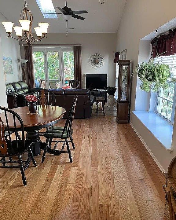 Bright open floorplan with windowseat and skylight
