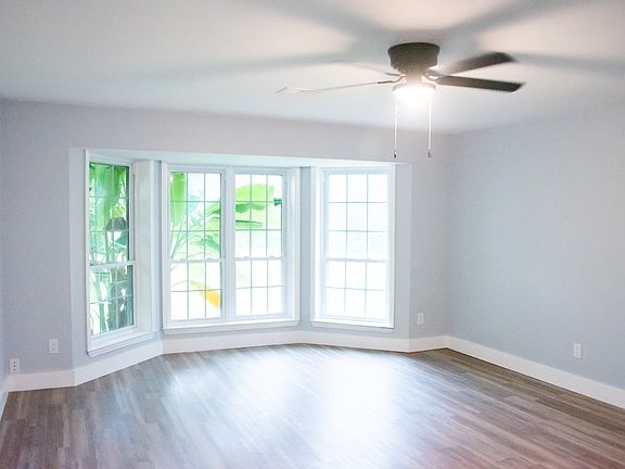 Dining room with beautiful bay windows looking out the front yard