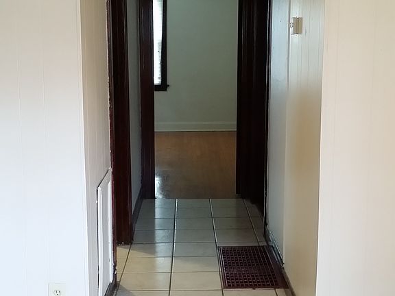 Hallway leading to the master bedroom ahead, restroom to the