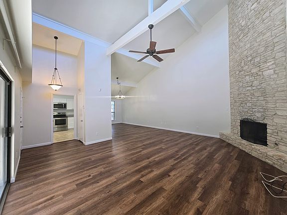 Living Room with High Vaulted Ceiling & Gas Fireplace