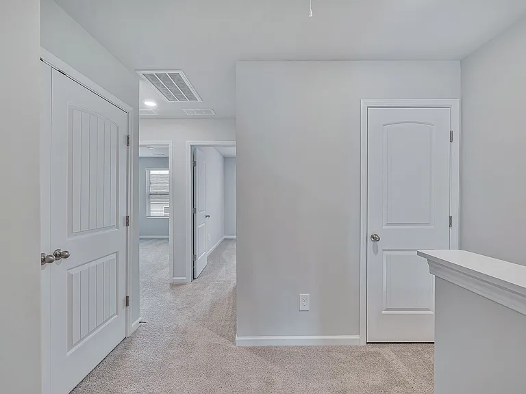 2nd floor landing with laundry closet on the left.