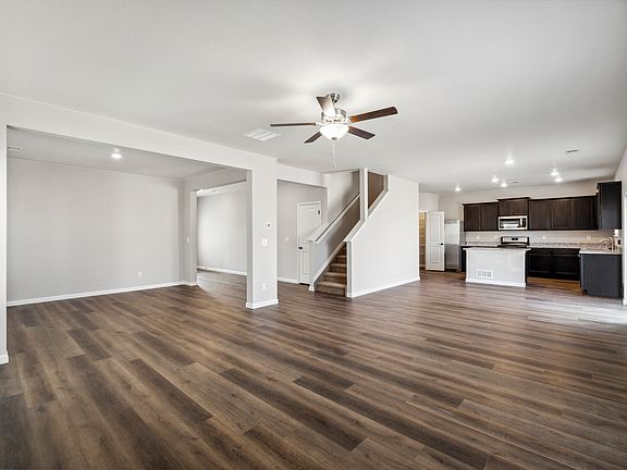 Open-concept layout, featuring the spacious living area and kitchen.