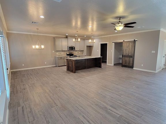 Spacious great room with view of the well appointed kitchen